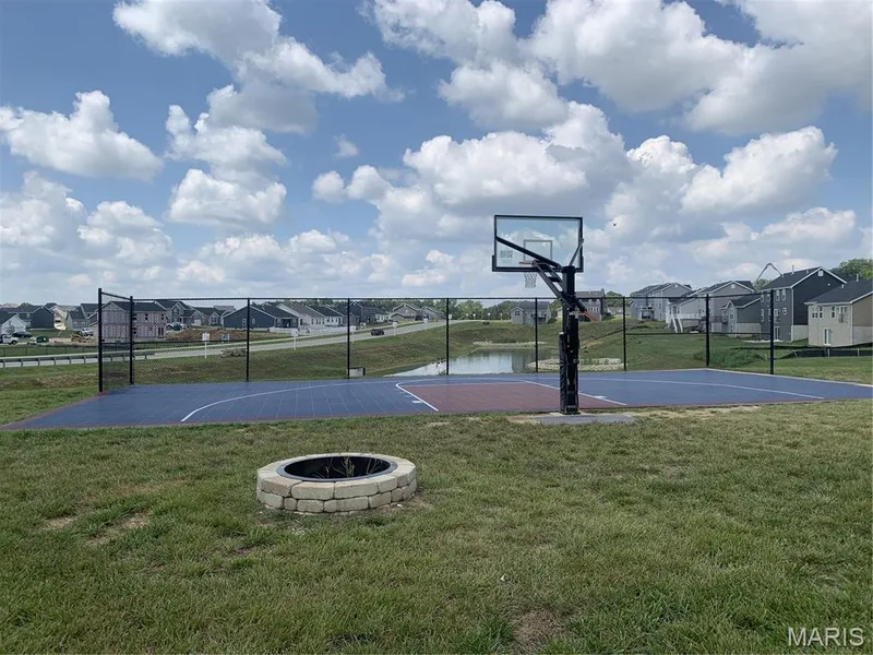 Sports court and fire pit for community use and enjoyment. Conveniently located next to the pavilion on Aspen Daisy Ct. — 403 Yellow Rose Court, Wentzville, MO 63385