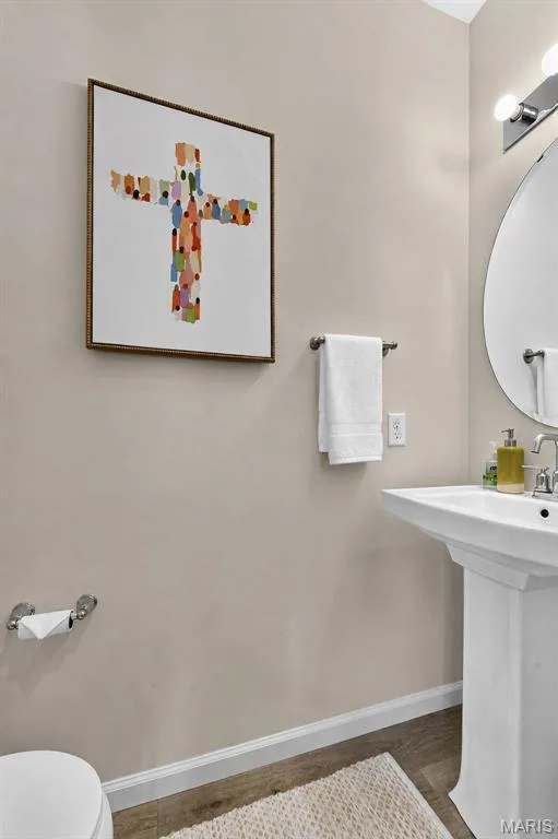 Half bath located on the main floor for convenience, yet tucked away for privacy. — 403 Yellow Rose Court, Wentzville, MO 63385