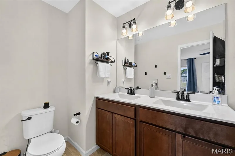 Enjoy your space with the double vanity sinks in the primary bathroom! — 403 Yellow Rose Court, Wentzville, MO 63385