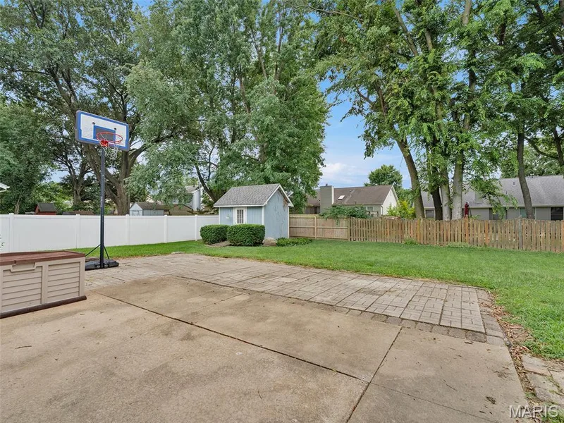 View of the back patio and shed.  Fully fenced yard. — 34 Shadow Creek Drive, St Peters, MO 63376
