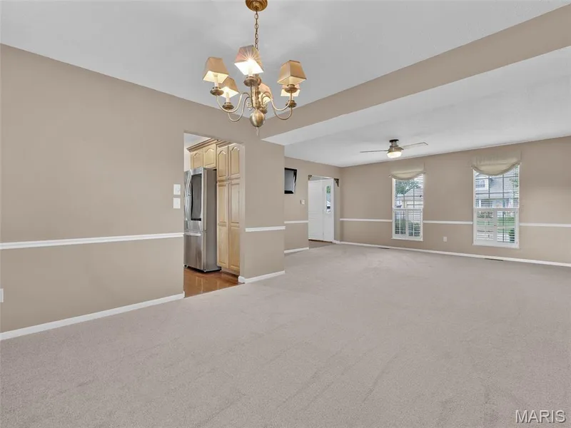 View from dining room looking toward living room and front door.  This home has really large rooms! — 34 Shadow Creek Drive, St Peters, MO 63376