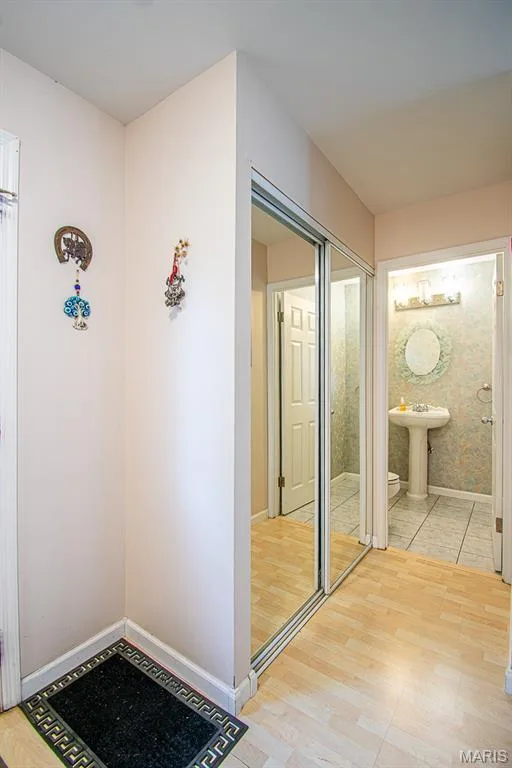 ENTRY FOYER – Coat Closet with Mirror Doors & Entrance to Half Bathroom — 13261 COCHERO Drive, Chesterfield, MO 63141