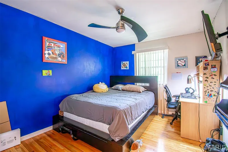 BEDROOM # 3 – With Walk-in closet & a niche for Dresser  - featuring wood-finish flooring, a ceiling fan with integrated lighting, and a window with blinds — 13261 COCHERO Drive, Chesterfield, MO 63141