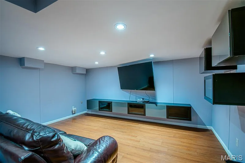 LOWER-LEVEL REC/R # 2 - Entertainment space featuring wood-finish flooring, recessed lighting, and wall-mounted shelving — 13261 COCHERO Drive, Chesterfield, MO 63141