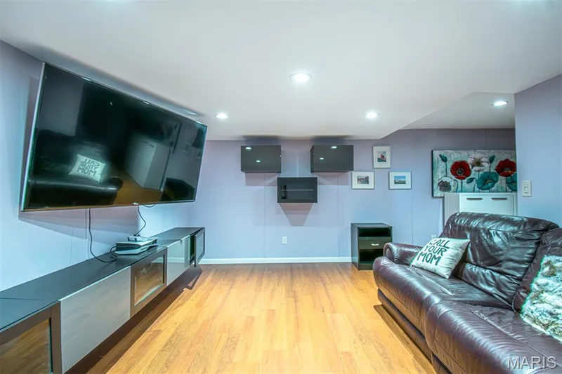 LOWER-LEVEL REC/R # 2 - Entertainment space featuring wood-finish flooring, recessed lighting, and wall-mounted shelving — 13261 COCHERO Drive, Chesterfield, MO 63141
