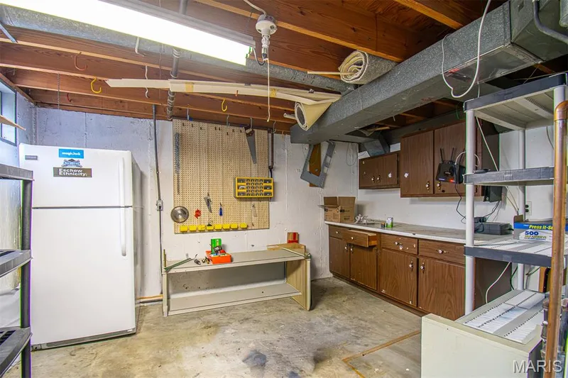 LOWER-LEVEL STORAGE AREA – Laundry/Utility/Workshop Hobby Area — 13261 COCHERO Drive, Chesterfield, MO 63141