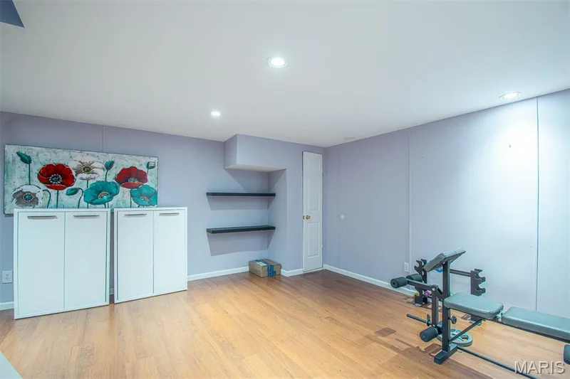 LOWER-LEVEL REC/R # 1 - featuring wood-finish flooring, recessed lighting, and wall-mounted shelving — 13261 COCHERO Drive, Chesterfield, MO 63141