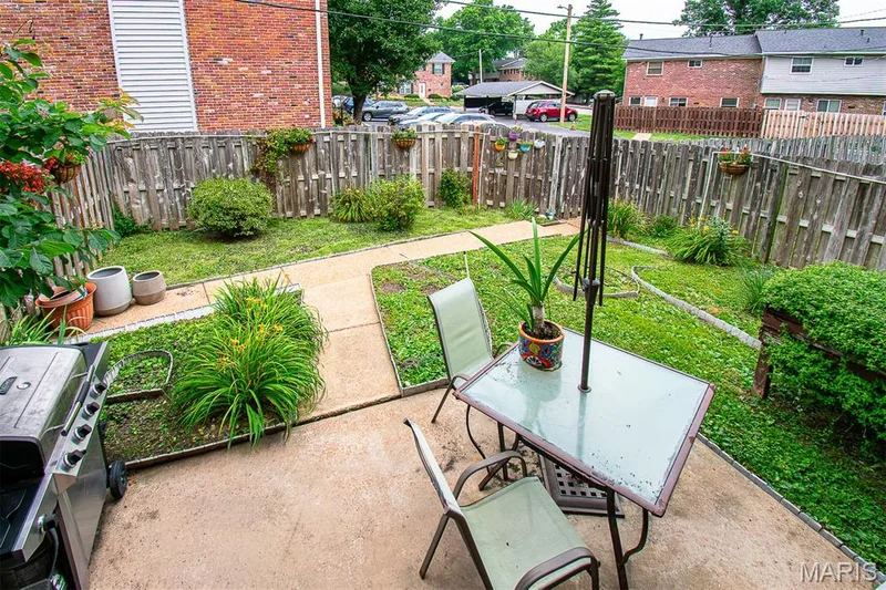 FENCED BACKYARD - Featuring a concrete patio, a pathway, and established plantings — 13261 COCHERO Drive, Chesterfield, MO 63141
