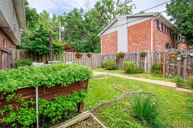 FENCED BACKYARD - Featuring a concrete patio, a pathway, and established plantings — 13261 COCHERO Drive, Chesterfield, MO 63141