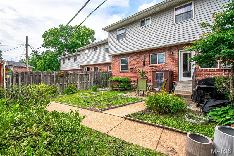 FENCED BACKYARD - Featuring a concrete patio, a pathway, and established plantings — 13261 COCHERO Drive, Chesterfield, MO 63141