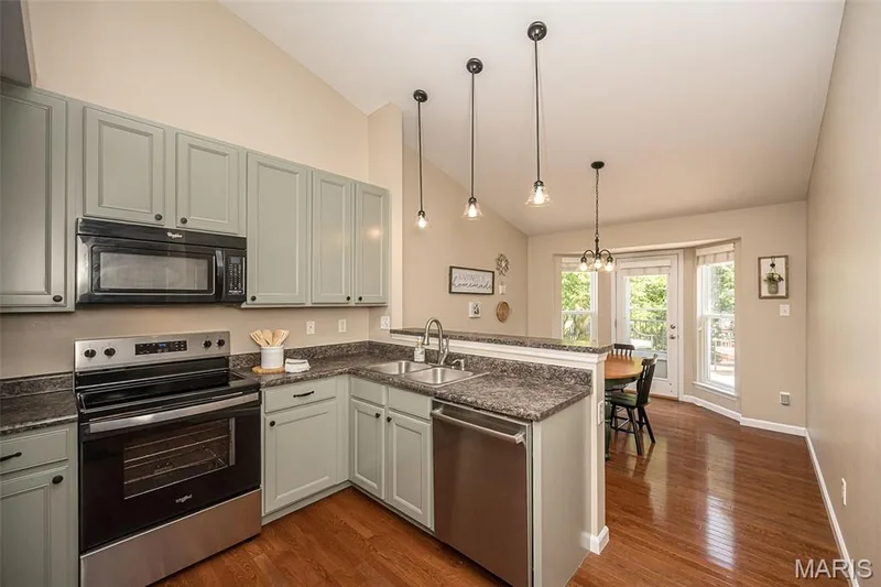 The kitchen overlooks the breakfast room which leads out to the new composite deck! — 249 Belmonte Circle, O'Fallon, MO 63368