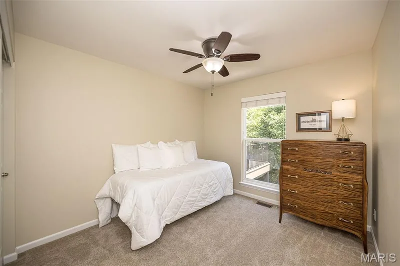 This secondary bedroom is located on the main floor across from the hall bathroom. This would be a great second bedroom or a home office. — 249 Belmonte Circle, O'Fallon, MO 63368