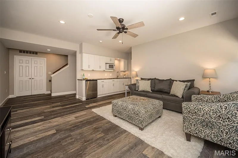 This basement is truly where it is at in this home! The soaring 9" ceilings, sliding glass door and windows make it feel like an extension of the main living area. — 249 Belmonte Circle, O'Fallon, MO 63368