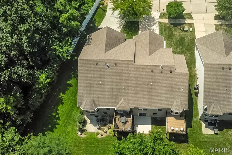 249 is the unit on the right with the new composite deck. What a private backyard that you don't have to maintain! — 249 Belmonte Circle, O'Fallon, MO 63368