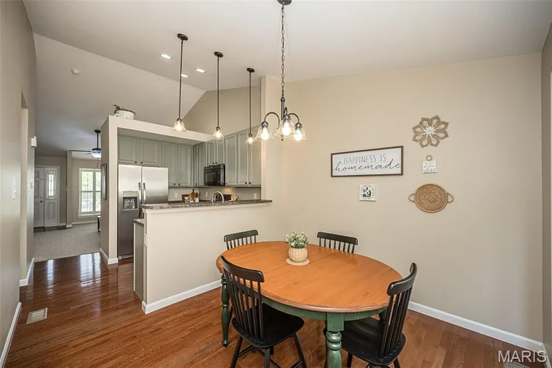 The flow in this home is wonderful! Hang out at the kitchen breakfast bar and watch the chef in action, or sit at the table and look out the window to enjoy the beautiful view! — 249 Belmonte Circle, O'Fallon, MO 63368