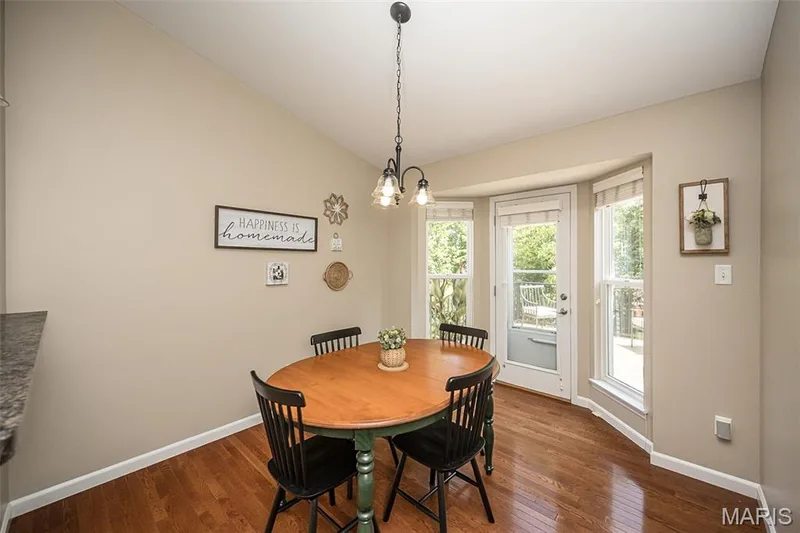 The flow in this home is wonderful! Hang out at the kitchen breakfast bar and watch the chef in action, or sit at the table and look out the window to enjoy the beautiful view! — 249 Belmonte Circle, O'Fallon, MO 63368
