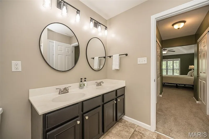 Another shot of the primary bathroom, which shows the parallel closets! — 249 Belmonte Circle, O'Fallon, MO 63368