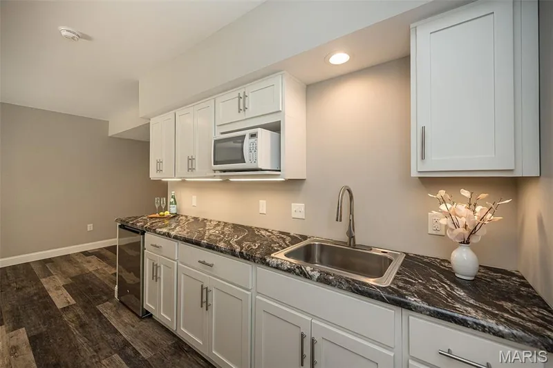 This lower level kitchenette offers so much storage space as well as functionality. — 249 Belmonte Circle, O'Fallon, MO 63368