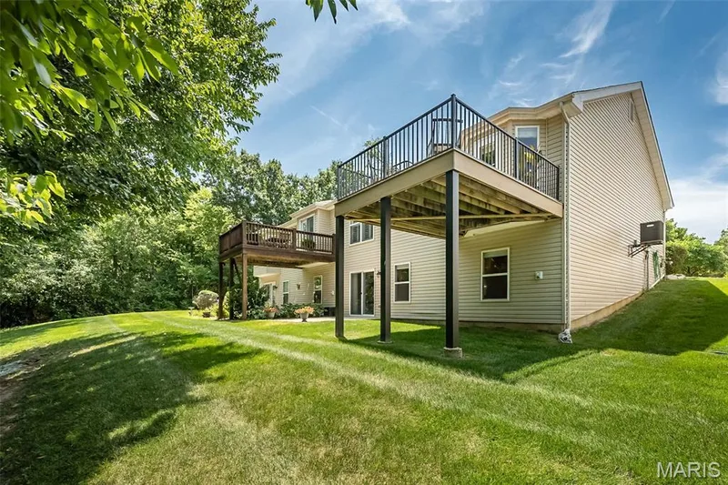 You can see you may be attached to one neighbor, but you have room to stretch out between your home and the next set of homes. — 249 Belmonte Circle, O'Fallon, MO 63368