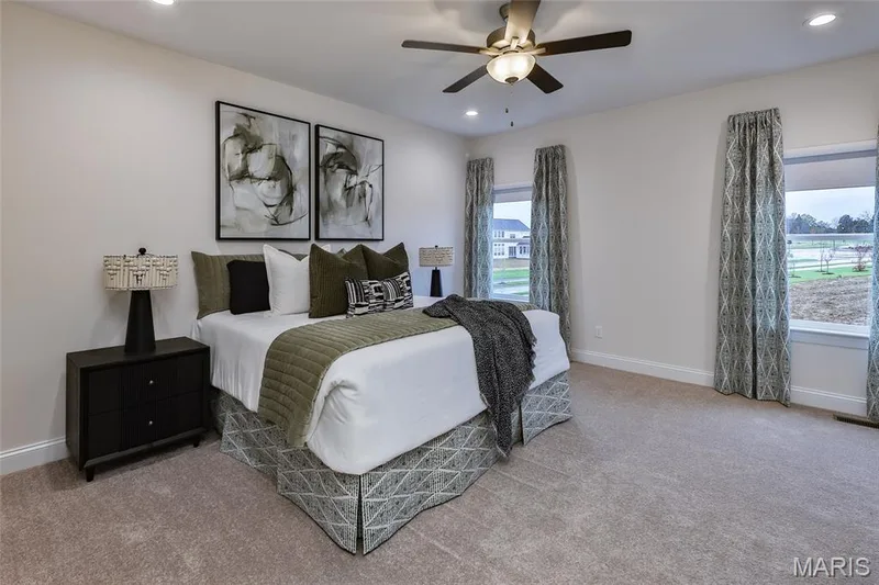 Primary bedroom with ceiling fan — 401 Farmhouse Drive, O'Fallon, MO 63385