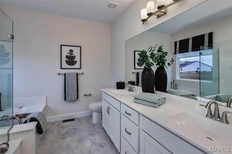 Primary bathroom with double wave bowl vanity — 401 Farmhouse Drive, O'Fallon, MO 63385