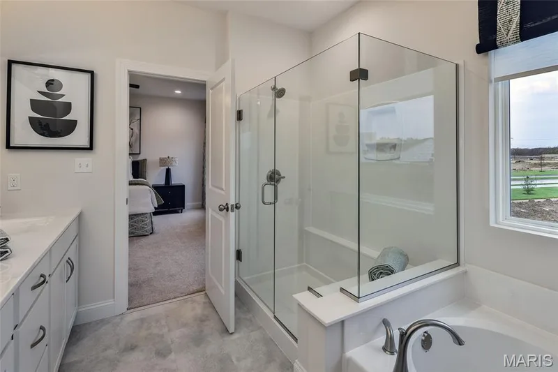 Primary bathroom with separate tub and shower — 401 Farmhouse Drive, O'Fallon, MO 63385