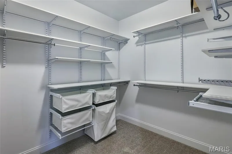 Primary bedroom custom closet — 401 Farmhouse Drive, O'Fallon, MO 63385