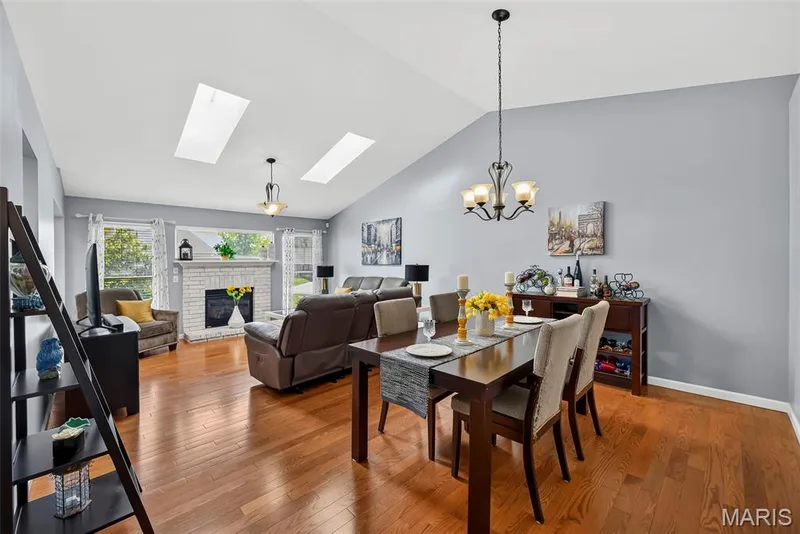 Vaulted dining into great room with fireplace & skylights. — 306 Villa Tuscany Court #10B, O'Fallon, MO 63366