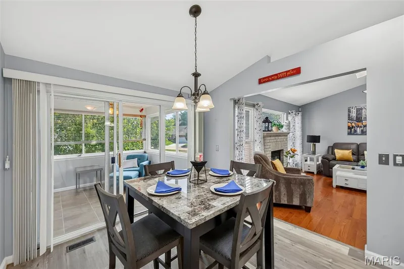 Breakfast room with view into 3 season room & great room. — 306 Villa Tuscany Court #10B, O'Fallon, MO 63366