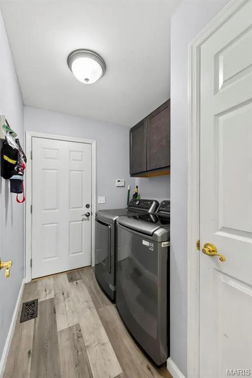 Main level laundry with cabinetry. — 306 Villa Tuscany Court #10B, O'Fallon, MO 63366