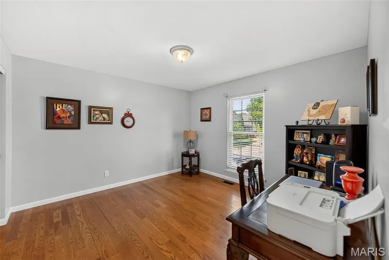 Second bedroom with hardwood flooring. — 306 Villa Tuscany Court #10B, O'Fallon, MO 63366
