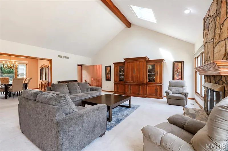 This vaulted ceiling features a wooden beam and lovely large windows. — 17507 Summit View Place Cove, Glencoe, MO 63038