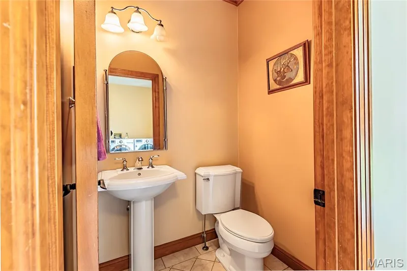Half Bath in the Laundry space, conveniently located off the oversized 3 Car Garage. — 17507 Summit View Place Cove, Glencoe, MO 63038