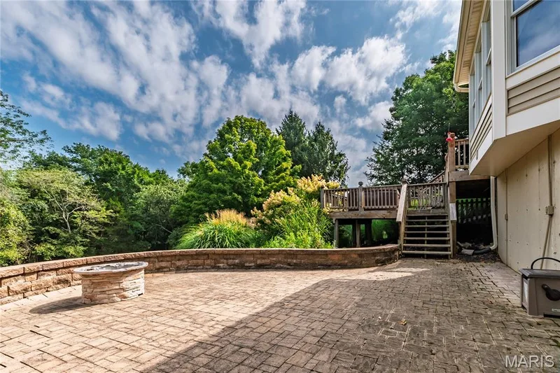 Custom stone patio with outdoor firepit. — 17507 Summit View Place Cove, Glencoe, MO 63038