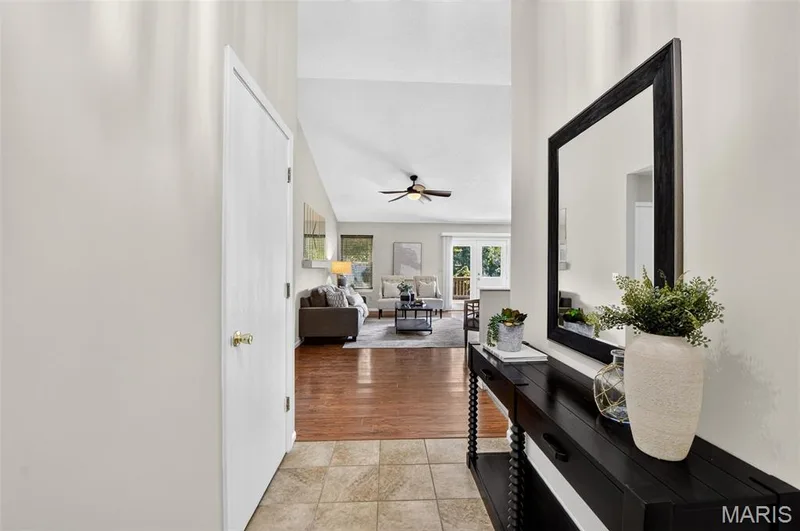 Entry foyer with a view of the family room - note the door to the left is a coat closet — 582 Prentice Drive, St Peters, MO 63376