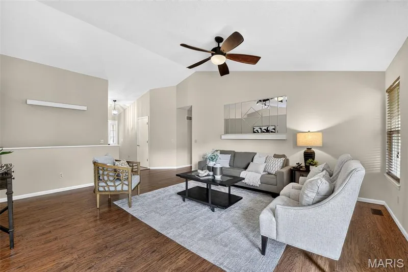 View of family room toward the front of the home and the hallway leads to 3 main floor bedrooms. — 582 Prentice Drive, St Peters, MO 63376
