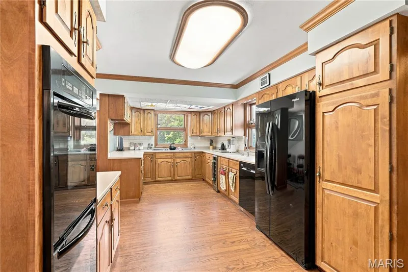 The Kitchen-Aid double oven makes hosting easy; there's a Laundry Room just off the kitchen — 505 Richley Drive, Chesterfield, MO 63017