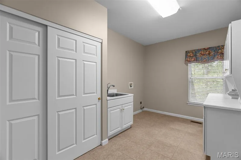 Main level laundry room — 991 Sheffield Forest Court, Wildwood, MO 63021