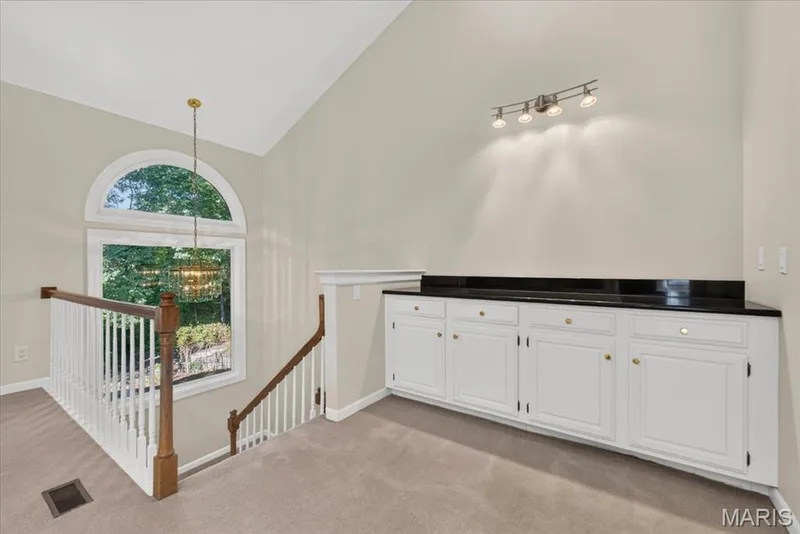 Large window overlooking your private backyard and steps down to your lower level. — 14620 Timberlake Manor Court, Chesterfield, MO 63017