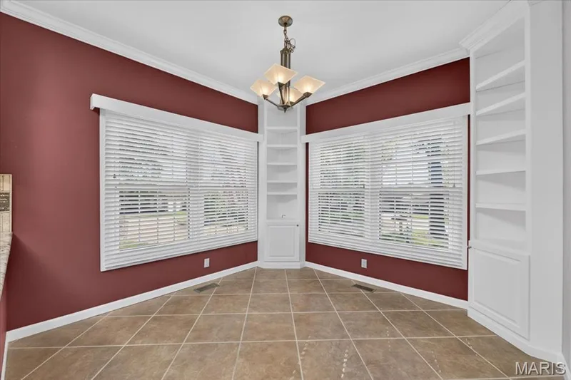 Breakfast area with lots of natural light and two corner storage cabinets with shelving. — 14620 Timberlake Manor Court, Chesterfield, MO 63017