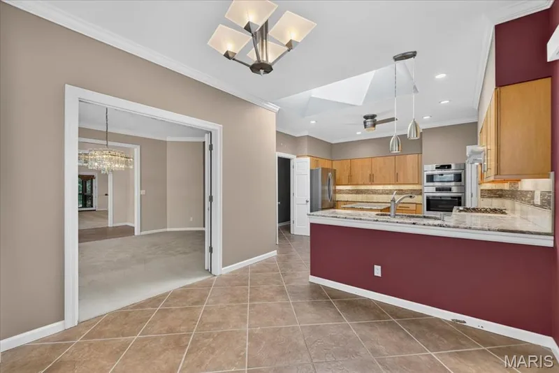 The breakfast area has two doors that open to the dining room. — 14620 Timberlake Manor Court, Chesterfield, MO 63017