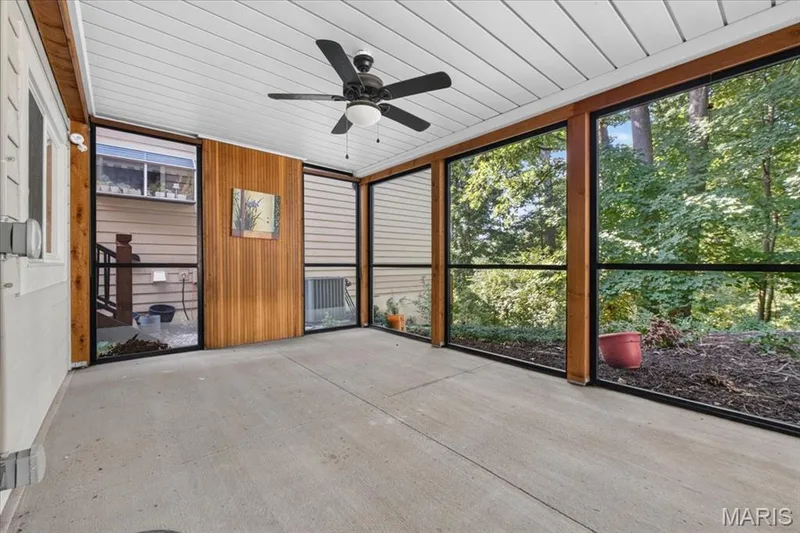 Lower-level screened porch which overlooks the private yard. — 14620 Timberlake Manor Court, Chesterfield, MO 63017