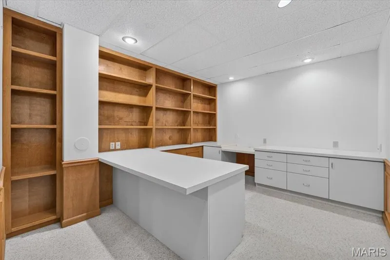 Lower-level office with built-in desk and storage. — 14620 Timberlake Manor Court, Chesterfield, MO 63017