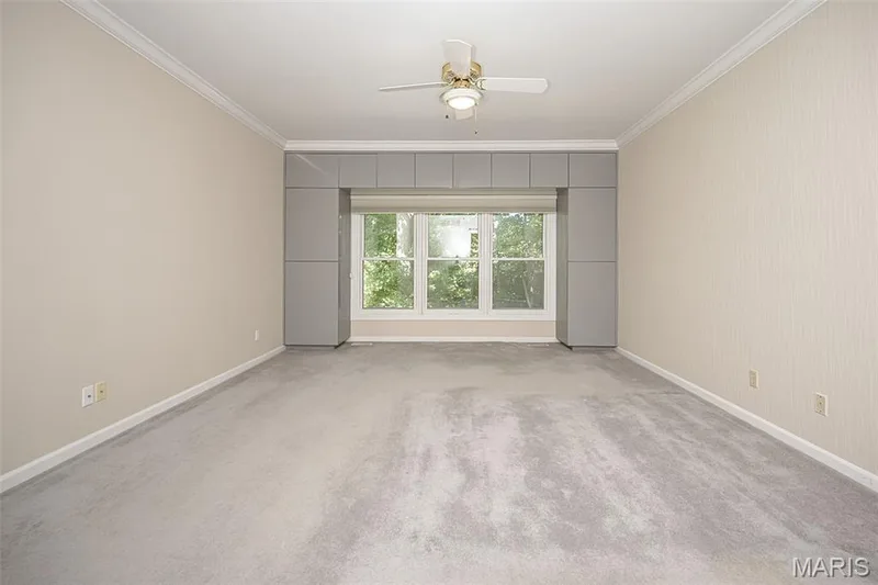 Freshly painted spacious primary bedroom with built-in storage that overlooks private back yard. — 14620 Timberlake Manor Court, Chesterfield, MO 63017