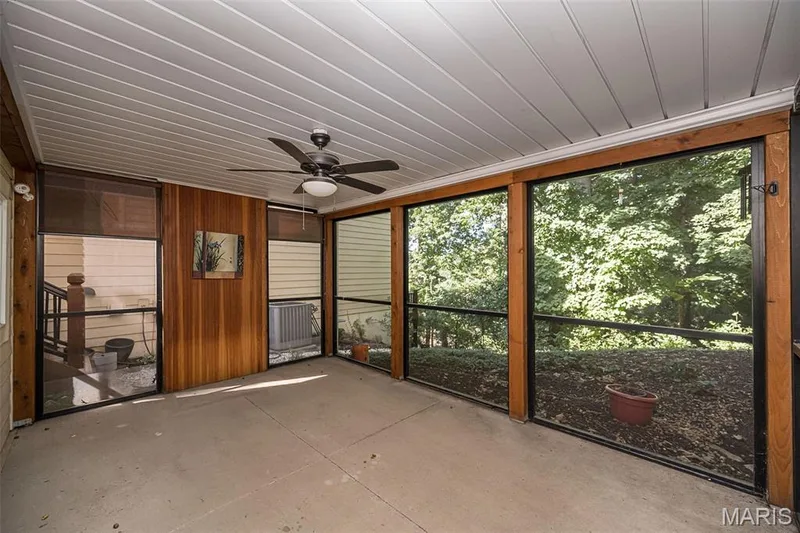 Lower-level screened porch overlooks treed area. — 14620 Timberlake Manor Court, Chesterfield, MO 63017