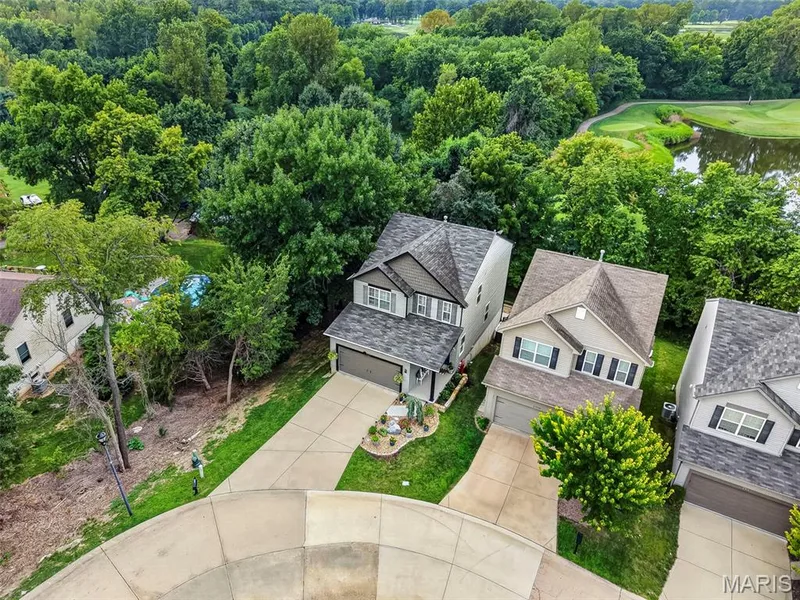 Aerial View of the Home on a Tree Lined Lot Backing to a Golf Course — 2322 Wills Hollow Drive, St Peters, MO 63376