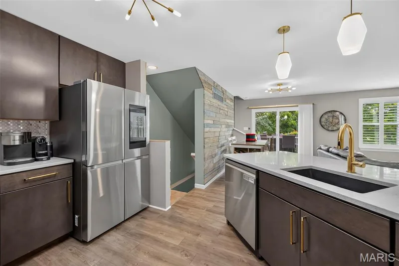 Kitchen with Luxury Vinyl Plank Flooring and Solid Surface Countertops — 2322 Wills Hollow Drive, St Peters, MO 63376