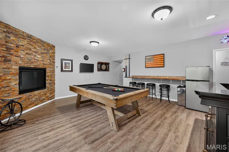 Recreation Room in the Finished Lower Level with 9 Foot Pour and Luxury Vinyl Plank Flooring — 2322 Wills Hollow Drive, St Peters, MO 63376