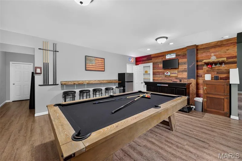 Recreation Room in the Finished Lower Level with 9 Foot Pour and Luxury Vinyl Plank Flooring — 2322 Wills Hollow Drive, St Peters, MO 63376