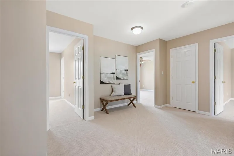 Head upstairs to a spacious central hallway connecting private bedrooms and bath quarters featuring brand-new carpeting throughout the upper level. — 354 Buckington Street, St Peters, MO 63376
